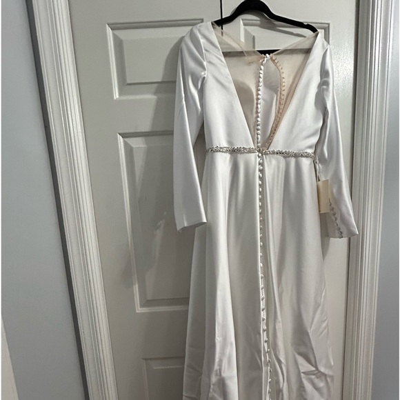 Wedding dress with tags. Rhinestone embellished at waist,real button closure. - Picture 2 of 7